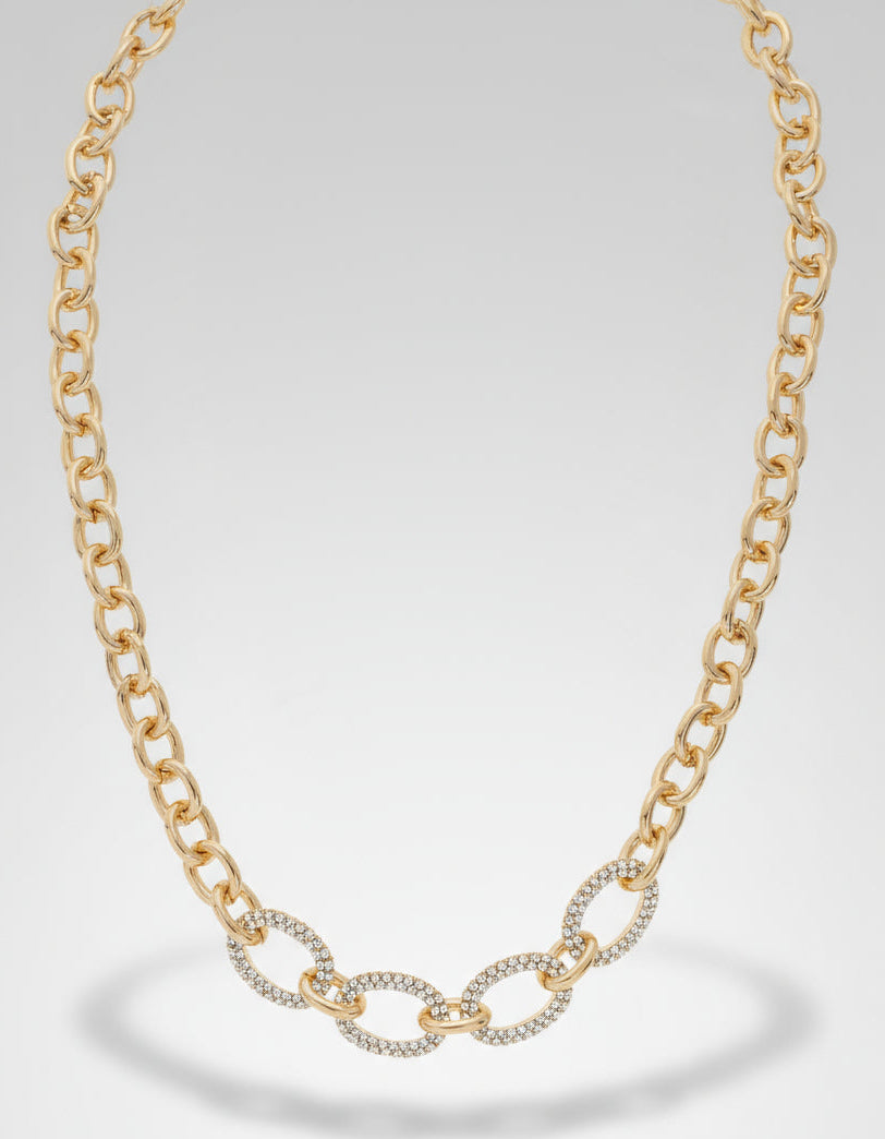 Gold chain necklace on a white background