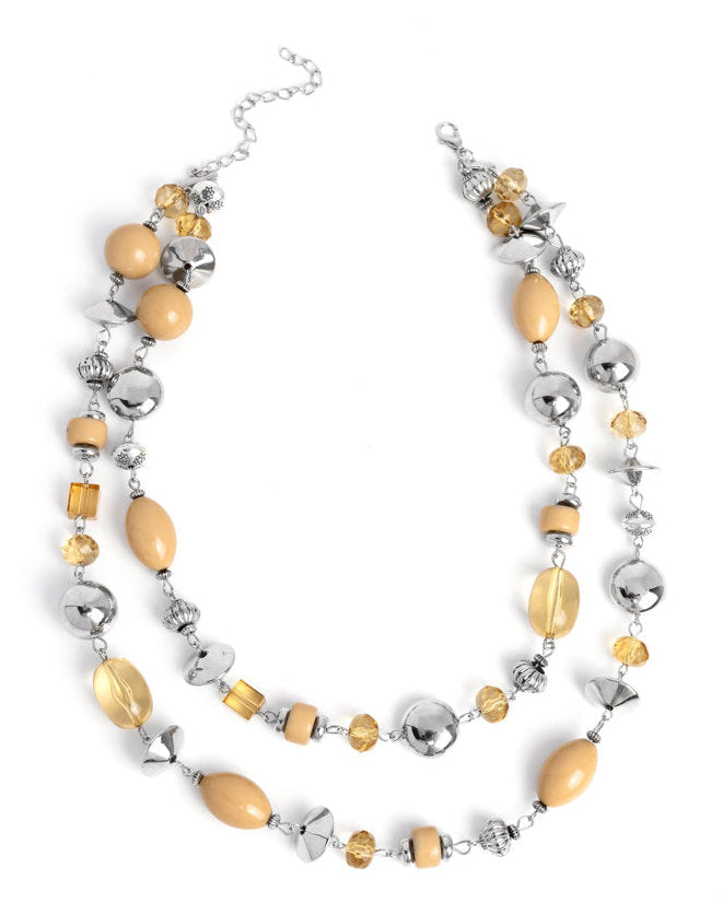 Necklace with yellow and silver beads on a white background
